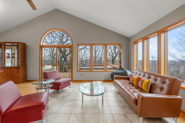 8440 Delaney Ct, Inver Grove Heights, MN 55076 - living room with plenty of natural light, a ceiling fan, high vaulted ceiling, and baseboards
