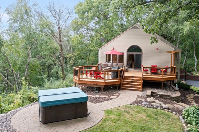 8440 Delaney Ct, Inver Grove Heights, MN 55076 - rear view of property featuring a hot tub, a wooden deck, and an outdoor hangout area