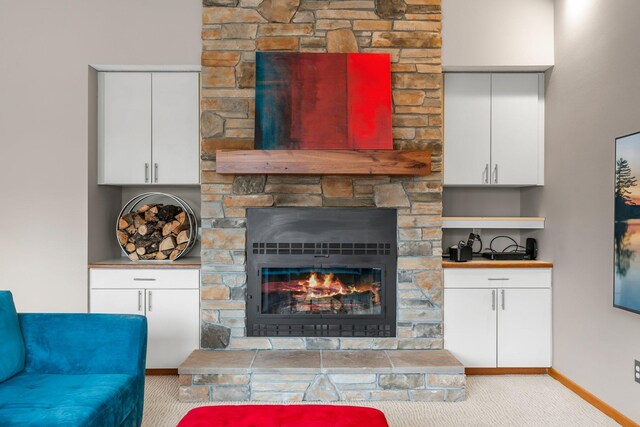 8440 Delaney Ct, Inver Grove Heights, MN 55076 - carpeted living area featuring baseboards and a stone fireplace