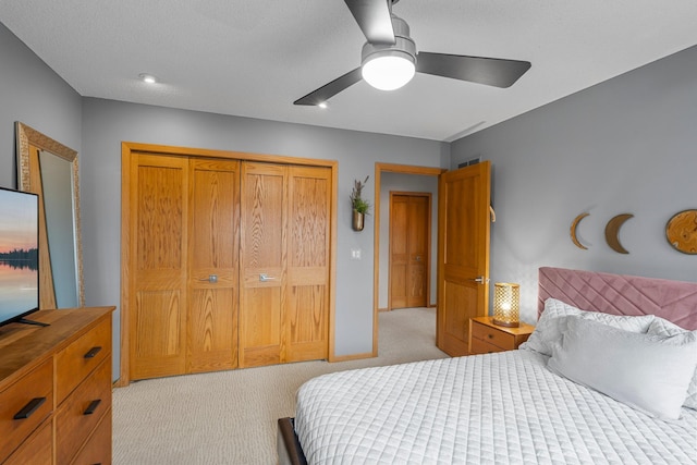 8440 Delaney Ct, Inver Grove Heights, MN 55076 - bedroom featuring light colored carpet, a closet, and ceiling fan