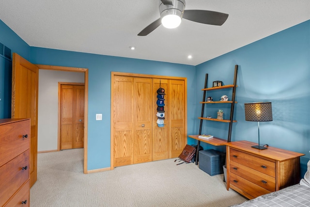 8440 Delaney Ct, Inver Grove Heights, MN 55076 - bedroom with carpet floors, a closet, baseboards, and a ceiling fan
