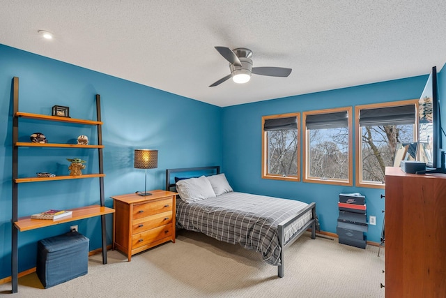 8440 Delaney Ct, Inver Grove Heights, MN 55076 - carpeted bedroom featuring a textured ceiling, baseboards, and a ceiling fan