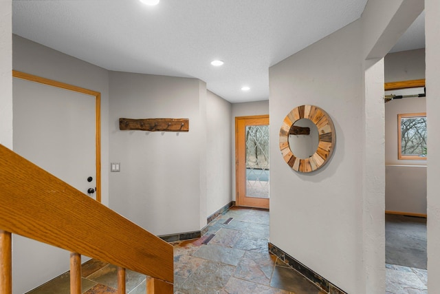 8440 Delaney Ct, Inver Grove Heights, MN 55076 - corridor featuring stone tile flooring, baseboards, and recessed lighting