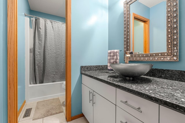 8440 Delaney Ct, Inver Grove Heights, MN 55076 - bathroom featuring toilet, vanity, shower / bathtub combination with curtain, and baseboards
