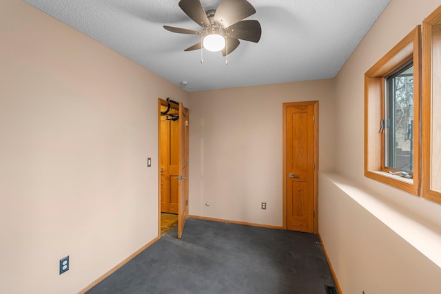 8440 Delaney Ct, Inver Grove Heights, MN 55076 - unfurnished room featuring dark colored carpet, ceiling fan, and baseboards