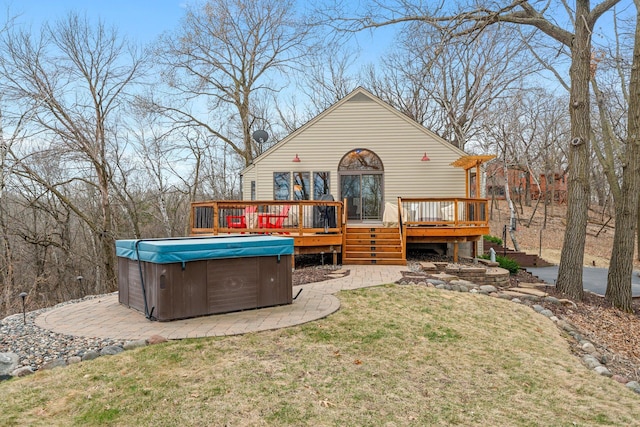 8440 Delaney Ct, Inver Grove Heights, MN 55076 - rear view of property with a hot tub, a deck, a yard, and a patio