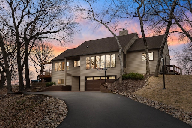 8440 Delaney Ct, Inver Grove Heights, MN 55076 - view of front of property featuring driveway, a chimney, a garage, and a shingled roof