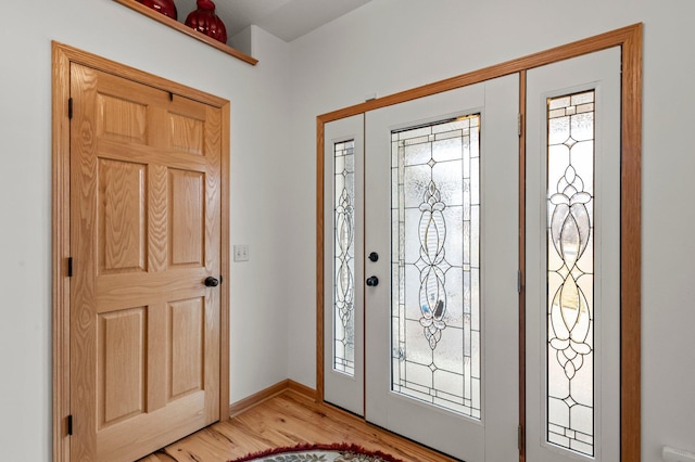 707 Bergman Ct NW, Isanti, MN 55040 - foyer featuring light wood-type flooring and baseboards