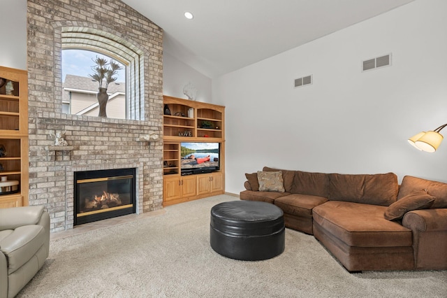 707 Bergman Ct NW, Isanti, MN 55040 - carpeted living area with high vaulted ceiling, a brick fireplace, visible vents, and recessed lighting