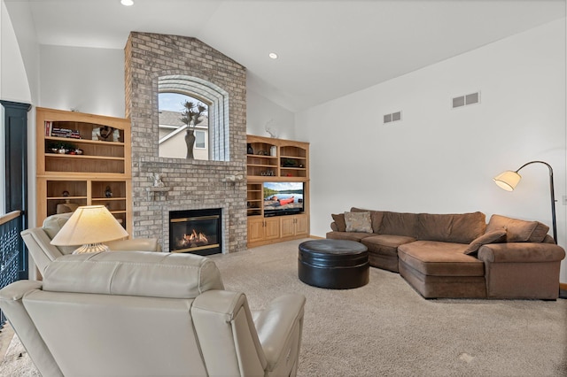 707 Bergman Ct NW, Isanti, MN 55040 - carpeted living room featuring a fireplace, lofted ceiling, visible vents, and recessed lighting