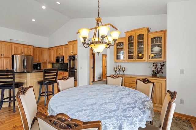 707 Bergman Ct NW, Isanti, MN 55040 - dining area with light wood-style floors, an inviting chandelier, recessed lighting, lofted ceiling, and baseboards