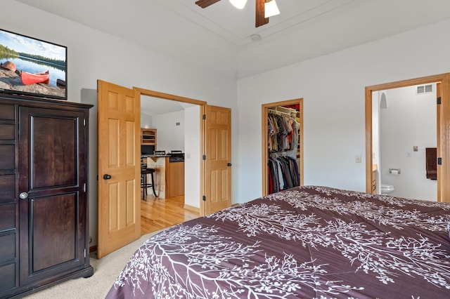 707 Bergman Ct NW, Isanti, MN 55040 - bedroom featuring visible vents, a closet, a spacious closet, a ceiling fan, and light carpet