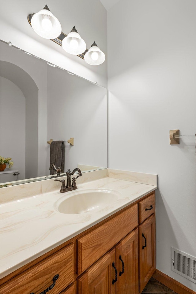 707 Bergman Ct NW, Isanti, MN 55040 - bathroom featuring visible vents and vanity