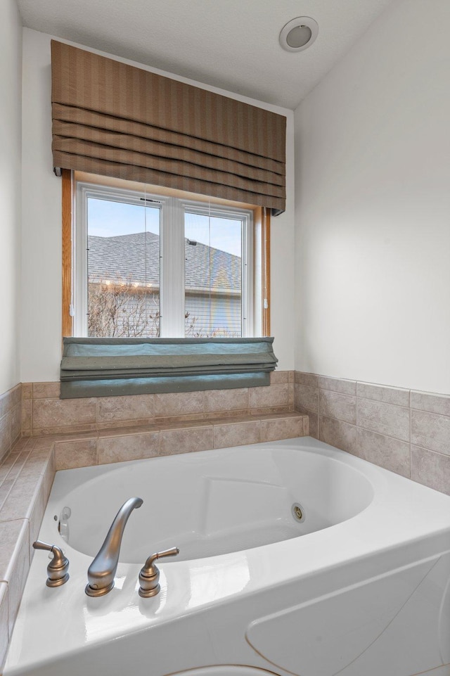 707 Bergman Ct NW, Isanti, MN 55040 - bathroom with a whirlpool tub