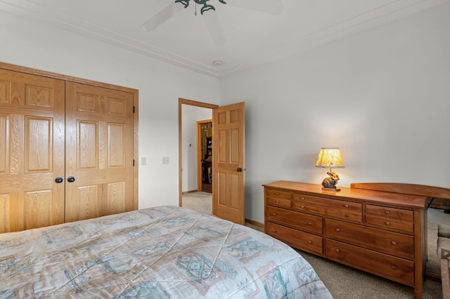 707 Bergman Ct NW, Isanti, MN 55040 - bedroom with carpet flooring, a closet, and a ceiling fan