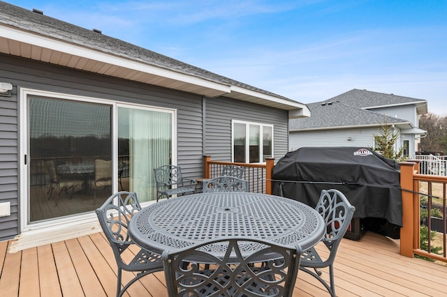 707 Bergman Ct NW, Isanti, MN 55040 - wooden terrace with area for grilling and outdoor dining area