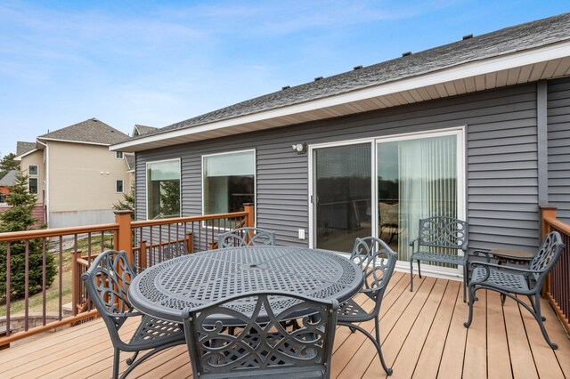 707 Bergman Ct NW, Isanti, MN 55040 - wooden terrace with outdoor dining area
