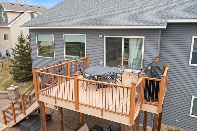 707 Bergman Ct NW, Isanti, MN 55040 - wooden deck with outdoor dining space