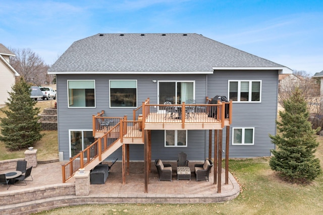 707 Bergman Ct NW, Isanti, MN 55040 - rear view of property featuring a shingled roof, an outdoor living space with a fire pit, stairway, a patio, and a wooden deck