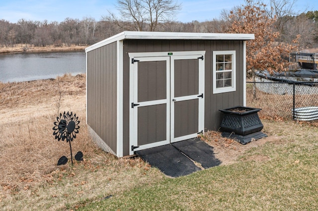 707 Bergman Ct NW, Isanti, MN 55040 - view of shed featuring a water view and fence