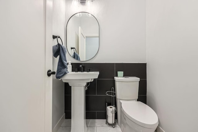 925 Minnesota Ln N, Plymouth, MN 55447 - half bathroom featuring marble finish floor, toilet, and a sink