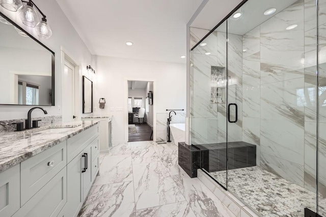 925 Minnesota Ln N, Plymouth, MN 55447 - bathroom featuring a soaking tub, a marble finish shower, recessed lighting, marble finish floor, and vanity