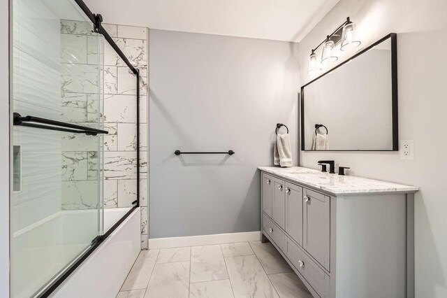 925 Minnesota Ln N, Plymouth, MN 55447 - bathroom featuring baseboards, marble finish floor, vanity, and shower / bath combination with glass door