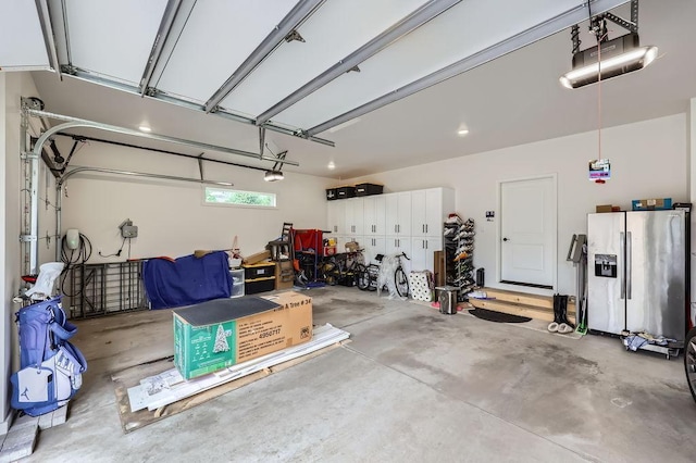 925 Minnesota Ln N, Plymouth, MN 55447 - garage featuring stainless steel refrigerator with ice dispenser and a garage door opener