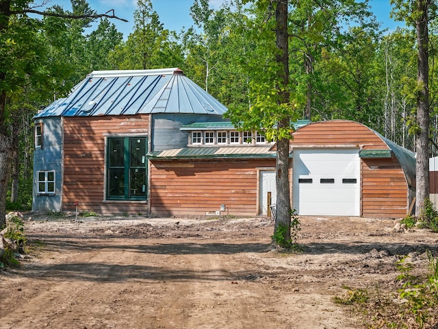 32838 County 16, Hart Lake Twp, MN 56461 - view of front of home with metal roof, driveway, a garage, and a standing seam roof