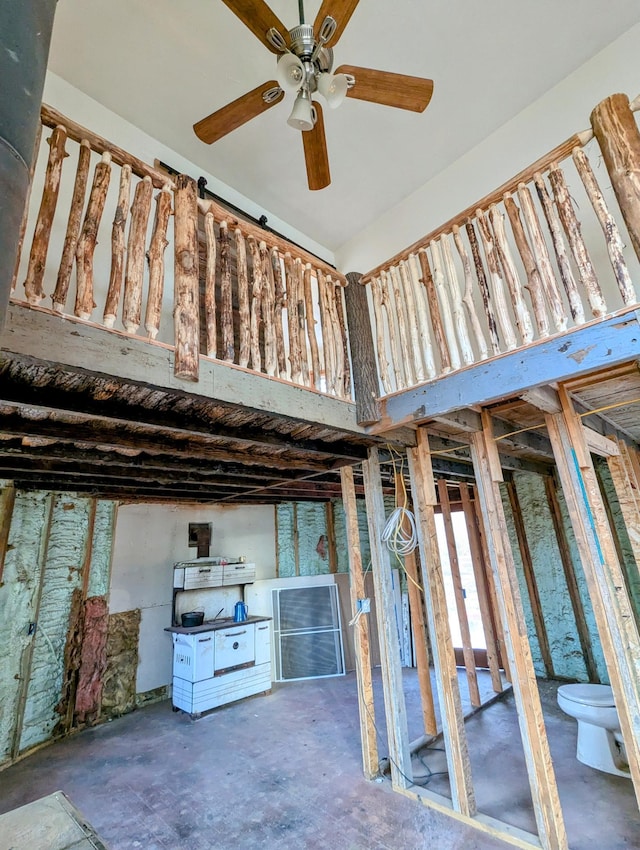 32838 County 16, Hart Lake Twp, MN 56461 - misc room with a ceiling fan, unfinished concrete floors, and a high ceiling