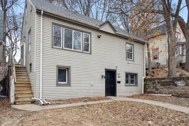 1119 6th St E, Saint Paul, MN 55106 - view of front of home with roof with shingles and stairway