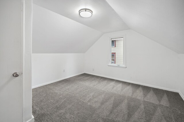 1119 6th St E, Saint Paul, MN 55106 - bonus room featuring baseboards, vaulted ceiling, and carpet floors