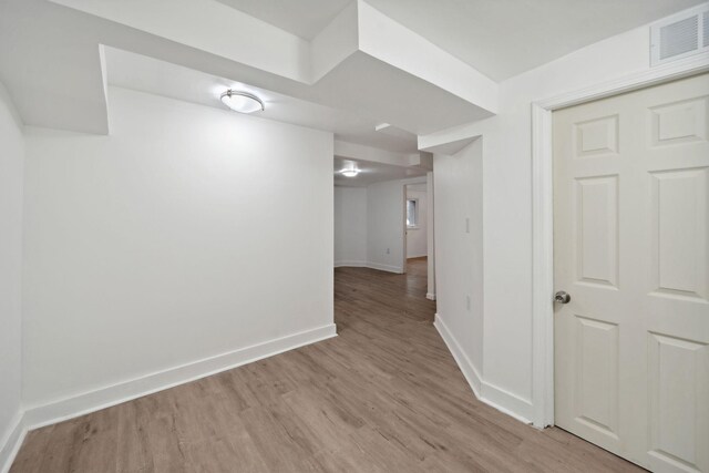 1119 6th St E, Saint Paul, MN 55106 - interior space featuring visible vents, light wood-style flooring, and baseboards
