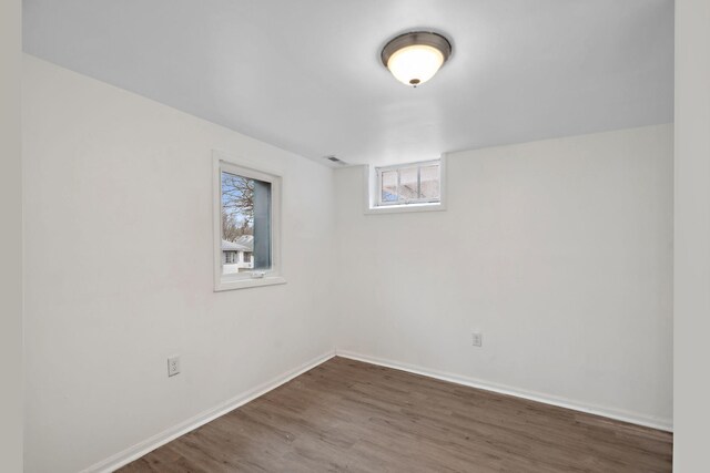1119 6th St E, Saint Paul, MN 55106 - below grade area featuring baseboards and wood finished floors