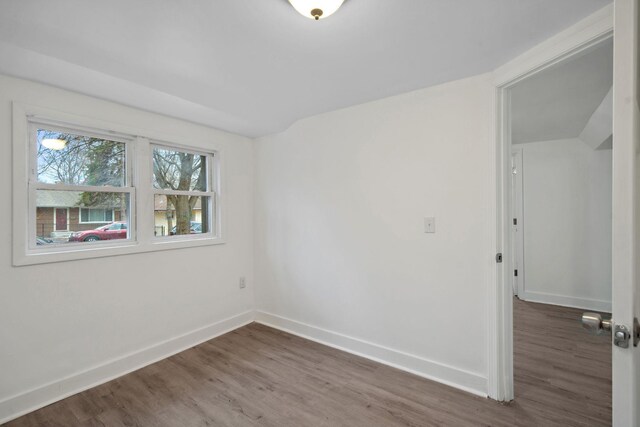 1119 6th St E, Saint Paul, MN 55106 - spare room featuring wood finished floors and baseboards