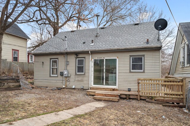 1119 6th St E, Saint Paul, MN 55106 - back of house featuring entry steps, a shingled roof, and fence