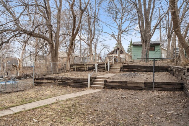 1119 6th St E, Saint Paul, MN 55106 - view of yard featuring stairway, a wooden deck, and fence