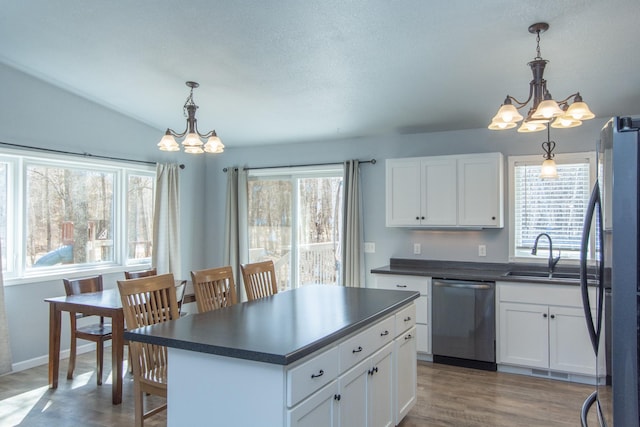 18885 Maryville Rd, Brainerd, MN 56401 - kitchen with a chandelier, dishwasher, dark countertops, and a sink