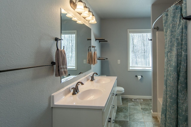 18885 Maryville Rd, Brainerd, MN 56401 - bathroom featuring plenty of natural light, double vanity, toilet, and shower / bath combination with curtain