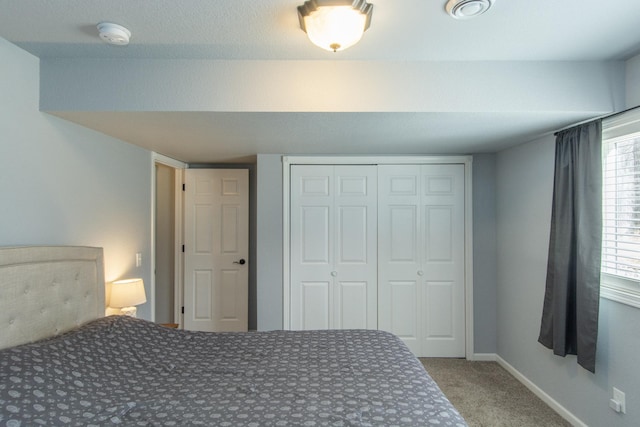 18885 Maryville Rd, Brainerd, MN 56401 - bedroom with carpet, a closet, and baseboards