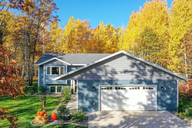 18885 Maryville Rd, Brainerd, MN 56401 - view of front of home with a front lawn, an attached garage, driveway, and roof with shingles