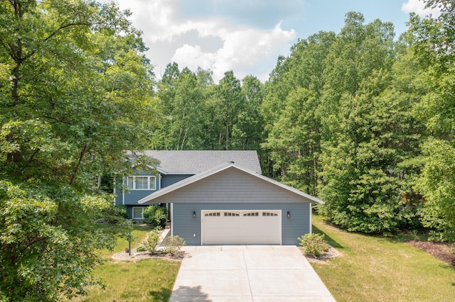 18885 Maryville Rd, Brainerd, MN 56401 - view of front of house with an attached garage, a front lawn, and driveway