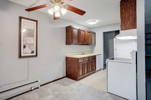 702 Old Settlers Trl Unit 3, Hopkins, MN 55343 - kitchen featuring a baseboard heating unit, white appliances, custom range hood, a ceiling fan, and light countertops