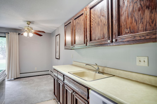 702 Old Settlers Trl Unit 3, Hopkins, MN 55343 - kitchen with a baseboard radiator, light carpet, light countertops, and ceiling fan