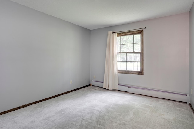 702 Old Settlers Trl Unit 3, Hopkins, MN 55343 - carpeted spare room featuring baseboards and a baseboard radiator