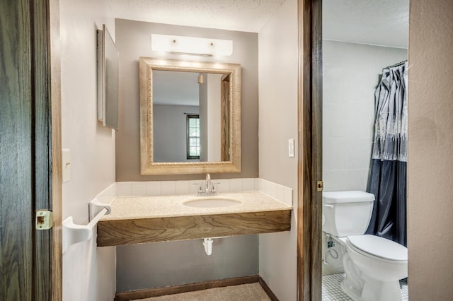 702 Old Settlers Trl Unit 3, Hopkins, MN 55343 - bathroom with a sink and a textured ceiling