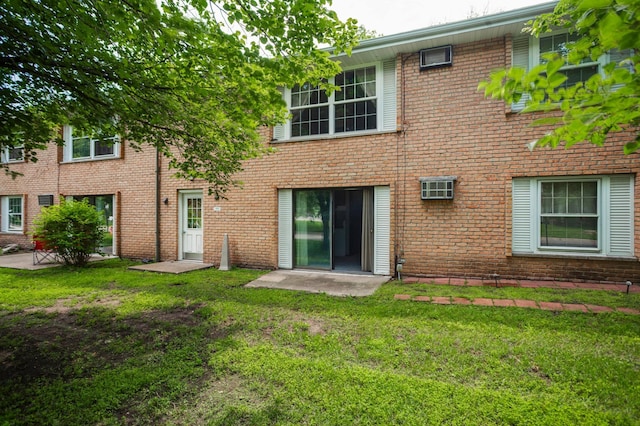 702 Old Settlers Trl Unit 3, Hopkins, MN 55343 - back of house featuring a yard and brick siding