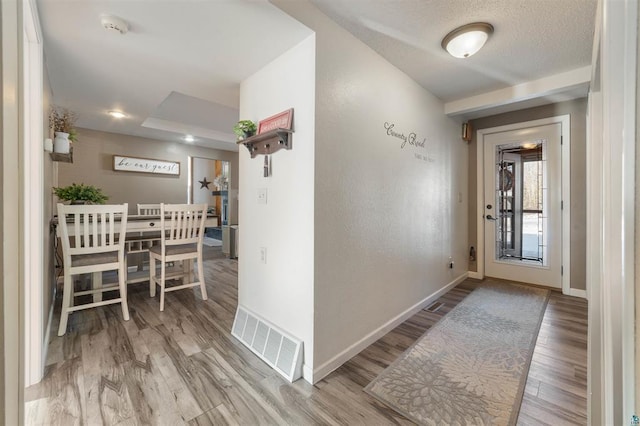 4463 Singkoffer Rd, Summit Twp, WI 54880 - hallway featuring baseboards and wood finished floors