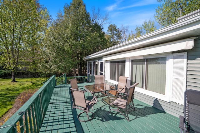 4463 Singkoffer Rd, Summit Twp, WI 54880 - deck featuring outdoor dining area and a yard