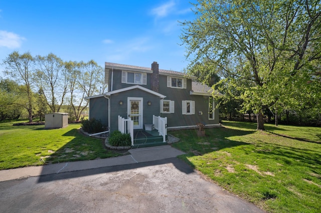 4463 Singkoffer Rd, Summit Twp, WI 54880 - view of front of house featuring a front lawn and a chimney